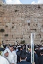 Crowd of Jewish worshipers in white wearing