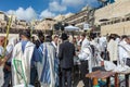 Crowd of Jewish worshipers in white wearing