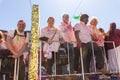 Crowd of joyous people celebrating the Indian Holi festival in Queens, United States.