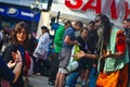 Crowd looking at street artist on Piccadilly Circus