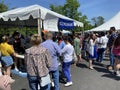 Crowd at the Loukoumades Tent at the Greek Festival in May