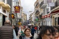 crowd of many tourists and shoppers