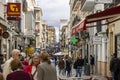 crowd of many tourists and shoppers