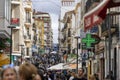 crowd of many tourists and shoppers