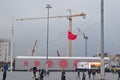 Crowd & massive construction tower cranes at Taksim Square with temporary setup & large screen, Beyoglu district, Istanbul, Turkey