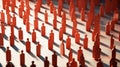 A crowd of orange wooden figures of people on a white background. Social survey and public opinion, the electorate. Population and Royalty Free Stock Photo