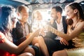 Crowd of party people in a limo with drinks Royalty Free Stock Photo