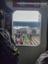 The crowd of passengers of a commuter train passengers as seen from the train window Royalty Free Stock Photo