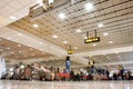 Crowd of the passengers inside the terminal of Dubai International airport in Dubai, UAE