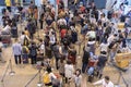 Crowd passengers with luggage in queue at check-in counter at airport, Thailand