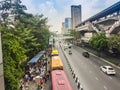 Crowd of passengers are queuing for bus at Phahon Yothin Road, interchange of Mochit BTS sky train station and Chatuchak MRT