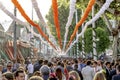 Crowd of people of all ages having fun and taking a walk at the Seville`s April Fair.