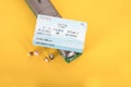 Crowd of people boarding the train and a train ticket on a yellow background Royalty Free Stock Photo