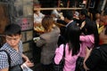 A crowd of people buying local Sichuan street food on Jinli Street, Chengdu