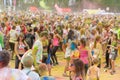 A crowd of people at a colorful race competition