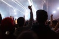 A crowd of people at the concert have fun and dance to the music at the concert. Rear view. The concept of entertainment and Royalty Free Stock Photo