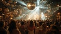 Crowd of people dancing under bright lights and disco balls at a vibrant night event Royalty Free Stock Photo