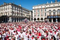 Crowd of people dressed in white and red at the Summer festival of Bayonne