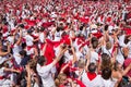 Crowd of people dressed in white and red at the Summer festival of Bayonne
