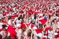 Crowd of people dressed in white and red at the Summer festival of Bayonne, France