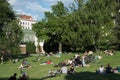 Crowd of people enjoying hot summer day in a park, reading, relaxing Royalty Free Stock Photo