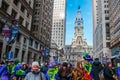 Crowd of people fill Broad Street in front of city hall before the New Years Day Mummers Parade