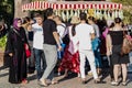 crowd of people in line for corn near traditional turkish cart