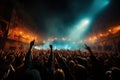 A crowd of people at a live event, concert or party holding hands and smartphones up. Royalty Free Stock Photo