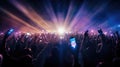 A crowd of people at a live event, concert or party holding hands and smartphones up