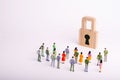 A crowd of people looks at the padlock. The concept of security, cyber-security and privacy of personal data of users.