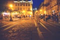 A crowd of people moving on the old european city night street defocused blurred abstract image Royalty Free Stock Photo