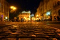 A crowd of people moving on the old european city night street defocused blurred abstract image Royalty Free Stock Photo