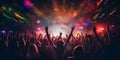 A crowd of people in a music event, dancing in neon pink color lights Royalty Free Stock Photo