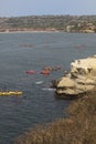 Crowd of People Paddle Boating with On Lookers