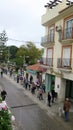 Crowd of people queuing outside bank on restricted opening day