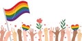 Crowd of people with rainbow flags and symbols on pride parade.Hands of multiethnic people making unity, togetherness, and support Royalty Free Stock Photo