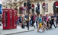 Crowd of people in the Regent street. Tourists, shoppers and business people rush time