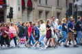 Crowd of people in the Regent street. Tourists, shoppers and business people rush time