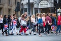 Crowd of people in the Regent street. Tourists, shoppers and business people rush time