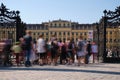 Crowd of people at Schonbrunn palace gate during day. Visitors, tourists