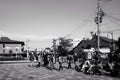 Crowd of people sitting and waiting at front of Saga-Arashiyama train station Royalty Free Stock Photo