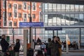 Crowd of people sitting and waiting for a train on the platforms of Wien Hauptbahnhof, the main train station of Vienna