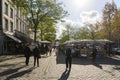 Crowd of people and stalls, stores, cafe and restaurant at Markt Maastricht around Stadhuis van Maastricht, City Hall. Royalty Free Stock Photo