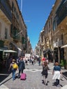 A crowd of people strolling on Republic Street in Valletta