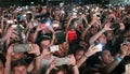 Crowd of people taking photos with the phone