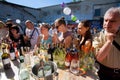 Crowd of people tasting wine in outdoor bar Royalty Free Stock Photo