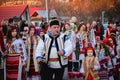 Crowd of people in traditional Romanian clothes in the New Year's eve parade, Bear Dance Ritual