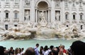 Crowd of people and Trevi Fountain in Rome city. It is it is the largest Baroque fountain in the