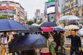 crowd of people with umbrellas at the famous Shibuya crossing in Tokyo, Japan