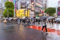 crowd of people with umbrellas at the famous Shibuya crossing in Tokyo, Japan